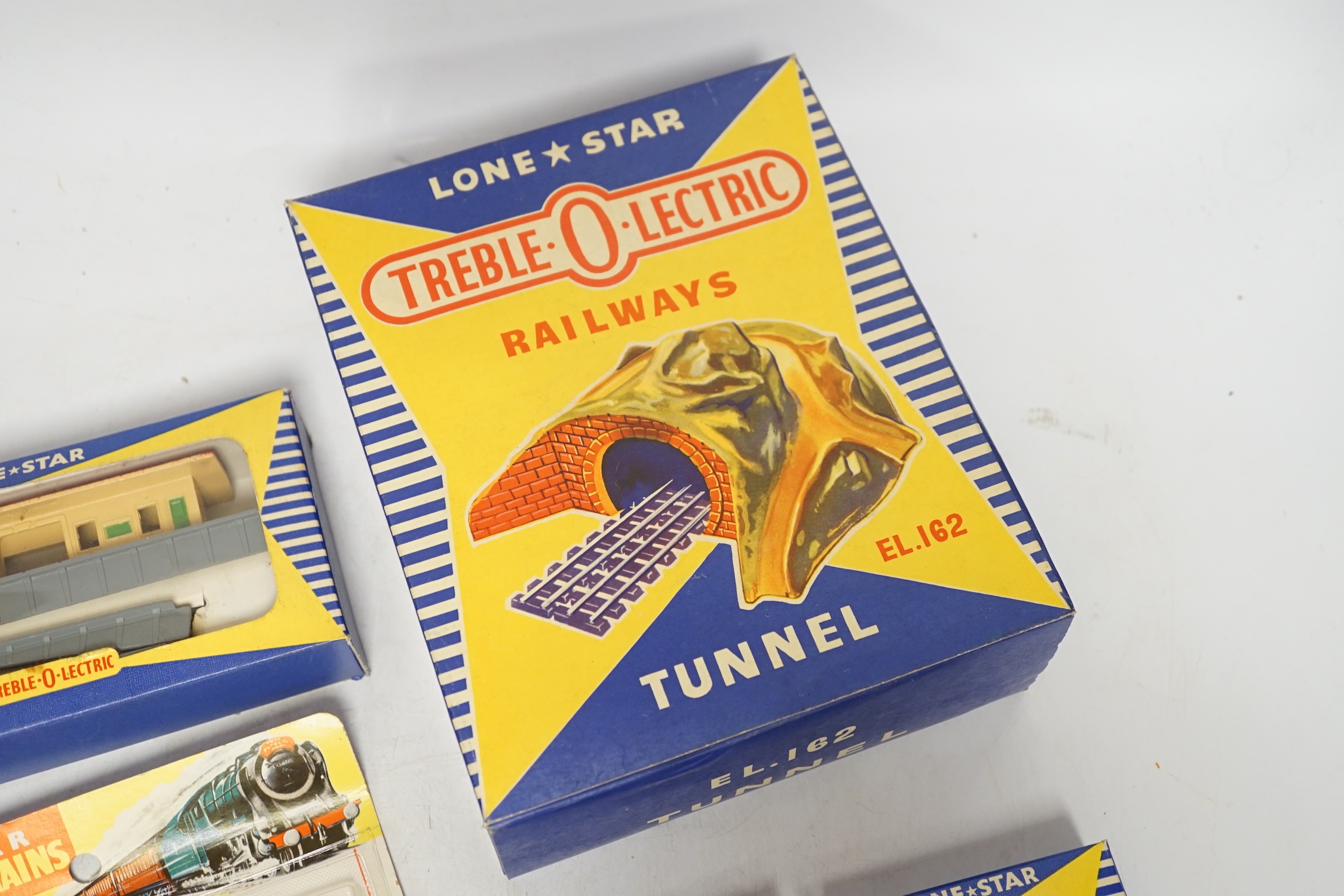 Sixty-two boxed items of Lone Star 000 gauge model railway including; a tunnel, Brake End Coaches, bogie wagons, station platforms, platform extensions, signal boxes, box vans, and telegraph poles